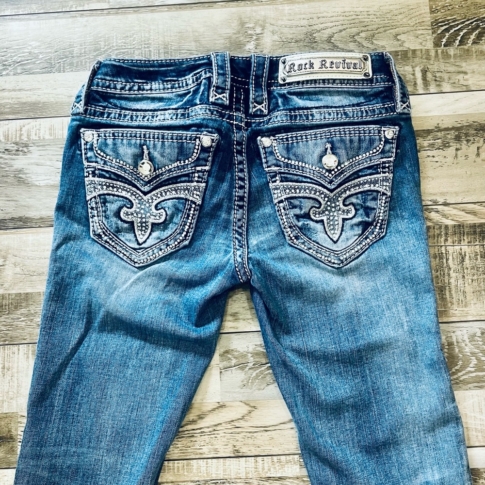 Rock Revival Blue Boot Cut Jeans with Ornate Design